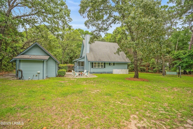 21 Planters Cir, Beaufort, SC 29907 - back of property with a patio, a chimney, and a lawn