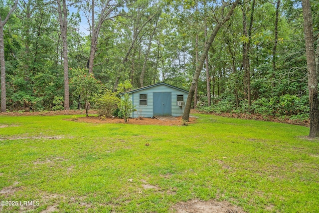 21 Planters Cir, Beaufort, SC 29907 - view of grassy yard featuring an outbuilding and a forest view