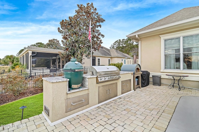 view of patio / terrace featuring grilling area and exterior kitchen