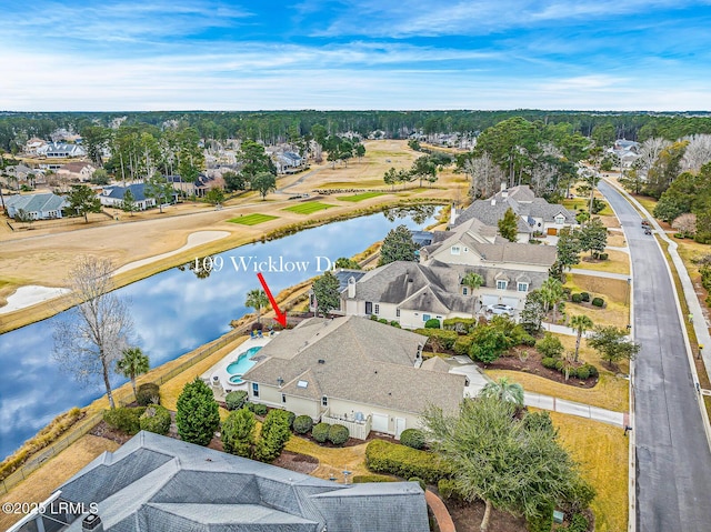 bird's eye view with a water view