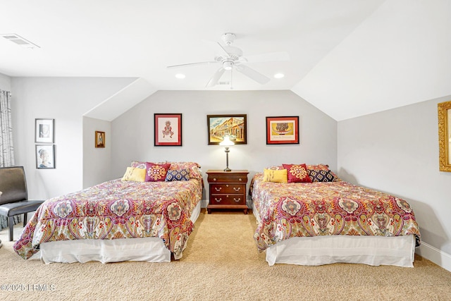 carpeted bedroom with vaulted ceiling and ceiling fan