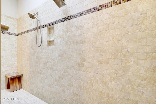 bathroom with tiled shower