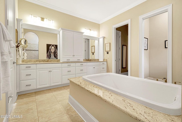 bathroom featuring crown molding, tile patterned floors, vanity, and a washtub