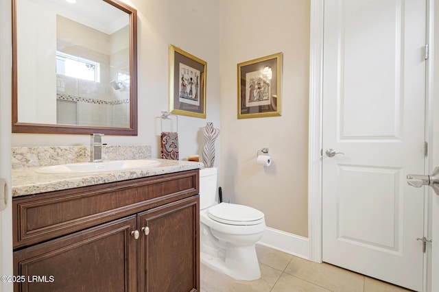 bathroom featuring vanity, tile patterned floors, and toilet