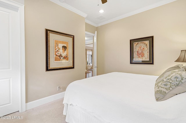 carpeted bedroom featuring crown molding and ceiling fan