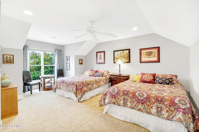 bedroom with vaulted ceiling, light colored carpet, and ceiling fan