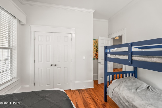2211 Wilson Dr, Beaufort, SC 29902 - bedroom with crown molding, wood finished floors, and a closet