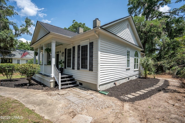 2211 Wilson Dr, Beaufort, SC 29902 - view of property exterior featuring a chimney, crawl space, and covered porch