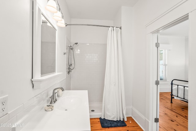 2211 Wilson Dr, Beaufort, SC 29902 - bathroom with a stall shower and wood finished floors