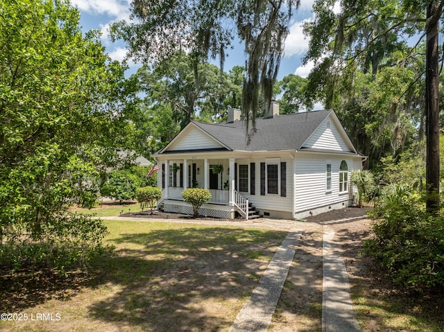 2211 Wilson Dr, Beaufort, SC 29902 - view of front of home featuring crawl space, a porch, a chimney, roof with shingles, and dirt driveway