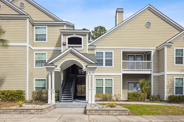 view of property featuring stairs