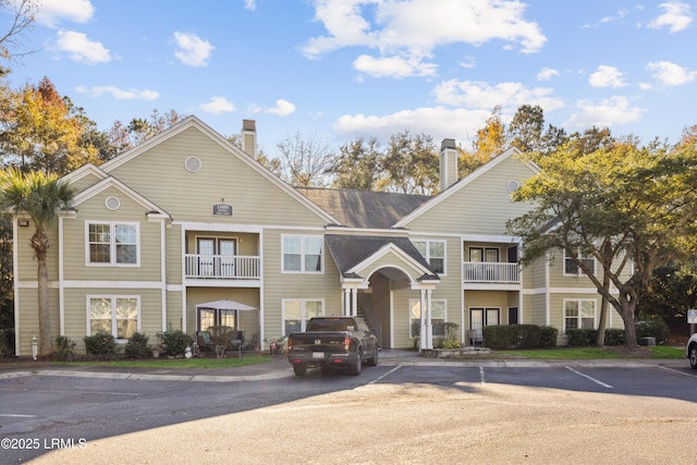 view of property with uncovered parking