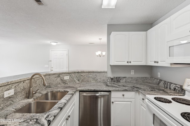 kitchen featuring light stone countertops, white appliances, white cabinetry, and a sink