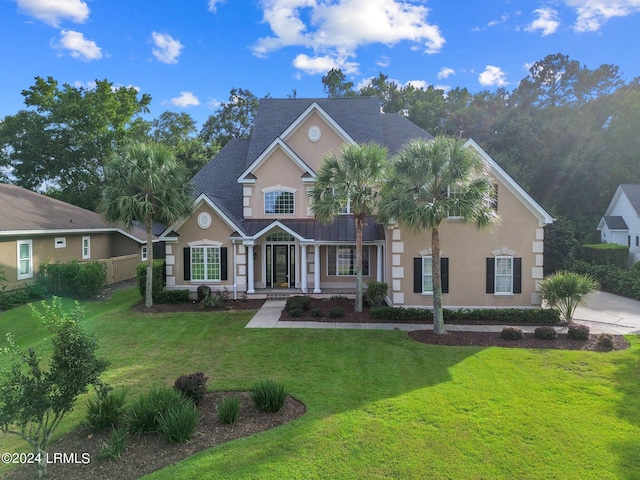 view of front of house with a front lawn