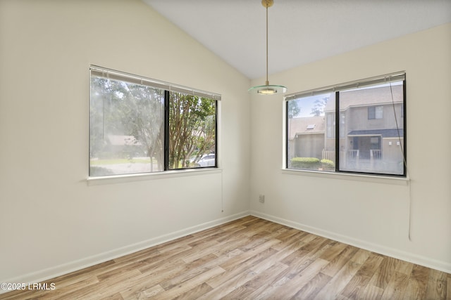 5 Gumtree Rd Unit I-32, Hilton Head Island, SC 29926 - unfurnished room with plenty of natural light, wood finished floors, and vaulted ceiling