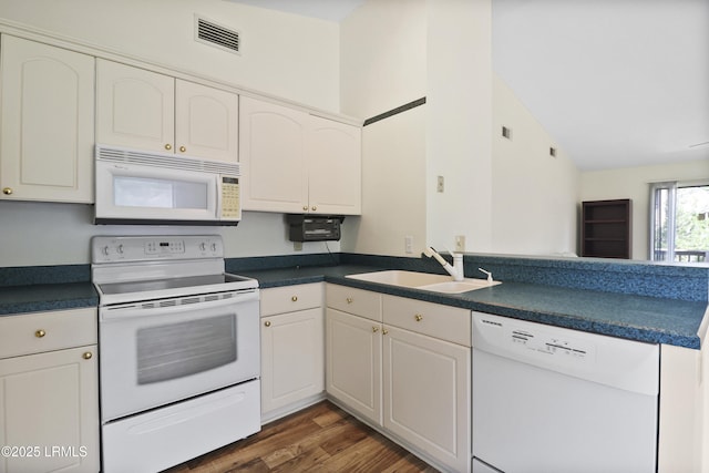5 Gumtree Rd Unit I-32, Hilton Head Island, SC 29926 - kitchen featuring white appliances, dark countertops, white cabinetry, and vaulted ceiling