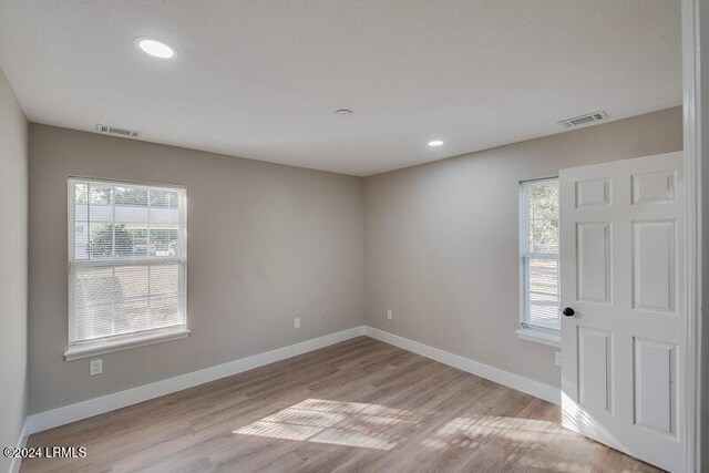 unfurnished room featuring light wood-type flooring