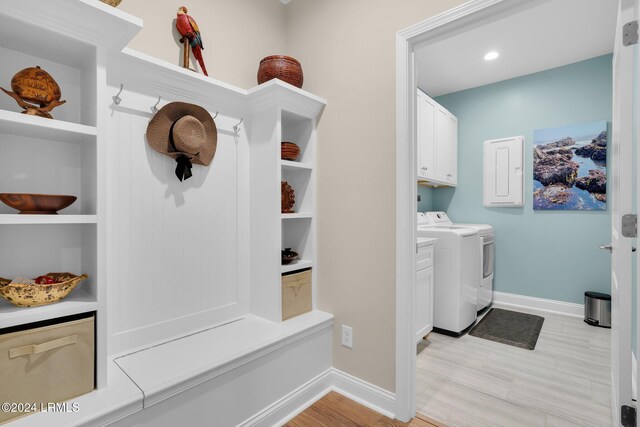 mudroom with electric panel and independent washer and dryer