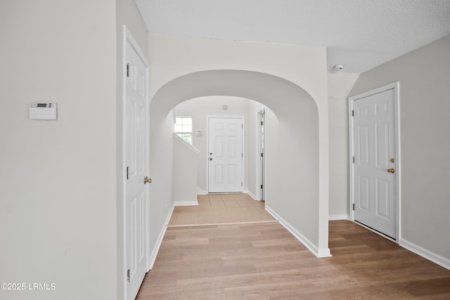 506 Cypress Cv, Bluffton, SC 29910 - hall featuring arched walkways and light wood-type flooring