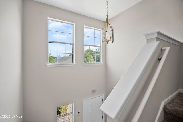 506 Cypress Cv, Bluffton, SC 29910 - stairway featuring a chandelier and a towering ceiling