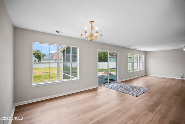 506 Cypress Cv, Bluffton, SC 29910 - unfurnished dining area with a chandelier, wood finished floors, and a ceiling fan