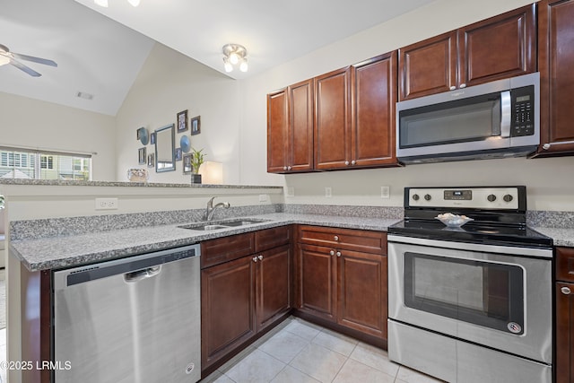 151 Bella Way, Beaufort, SC 29906 - kitchen with appliances with stainless steel finishes, lofted ceiling, a peninsula, light tile patterned floors, and ceiling fan