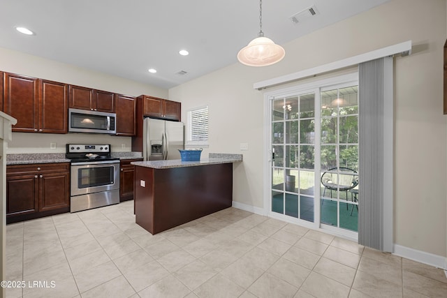 151 Bella Way, Beaufort, SC 29906 - kitchen featuring appliances with stainless steel finishes, a peninsula, decorative light fixtures, light tile patterned floors, and recessed lighting