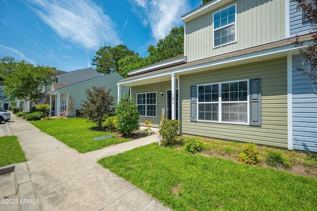 151 Bella Way, Beaufort, SC 29906 - traditional-style house with a front lawn and board and batten siding