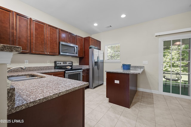 151 Bella Way, Beaufort, SC 29906 - kitchen featuring stainless steel appliances, light tile patterned floors, a peninsula, and recessed lighting