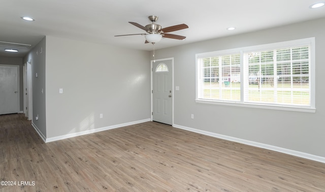 interior space with light hardwood / wood-style flooring and ceiling fan