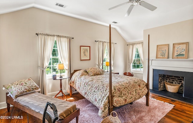 bedroom featuring vaulted ceiling, dark hardwood / wood-style floors, and ceiling fan