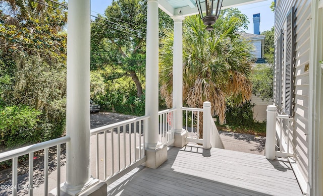 wooden terrace with a porch