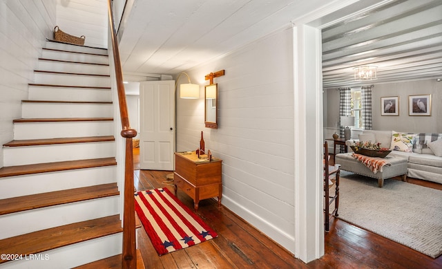 staircase featuring hardwood / wood-style flooring