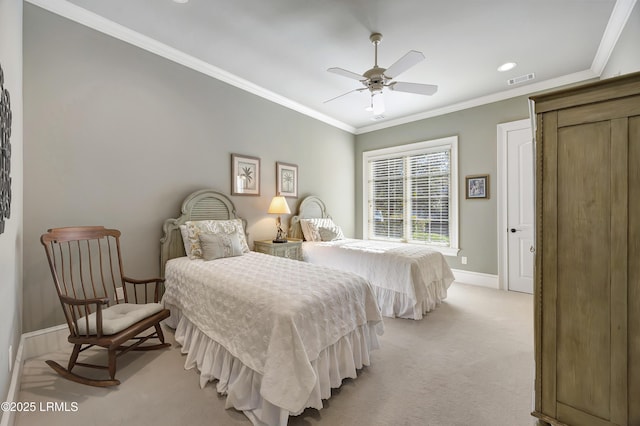 bedroom with ornamental molding, light colored carpet, and ceiling fan