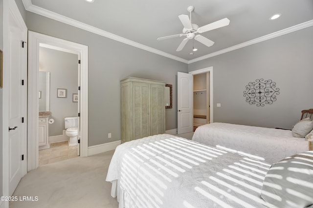 bedroom with light carpet, connected bathroom, crown molding, and a closet