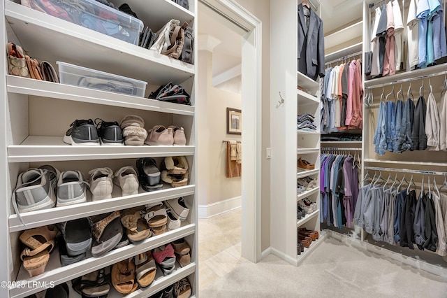 spacious closet featuring light tile patterned floors