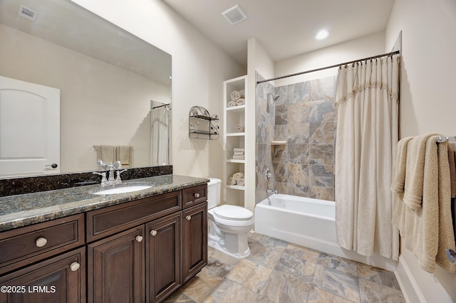 full bathroom featuring vanity, toilet, and shower / tub combo