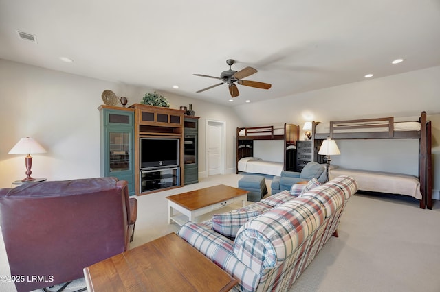 bedroom with ceiling fan, lofted ceiling, and light carpet