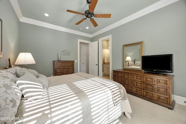 carpeted bedroom with crown molding, ceiling fan, and ensuite bathroom