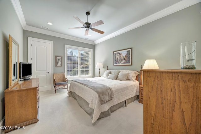 bedroom featuring ornamental molding, light colored carpet, and ceiling fan