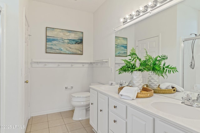 bathroom featuring vanity, walk in shower, tile patterned floors, and toilet