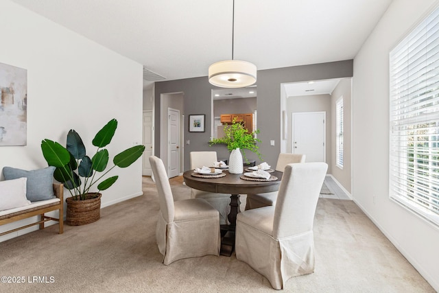 view of carpeted dining space