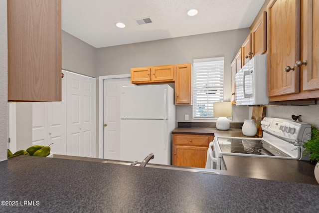 kitchen featuring sink and white appliances