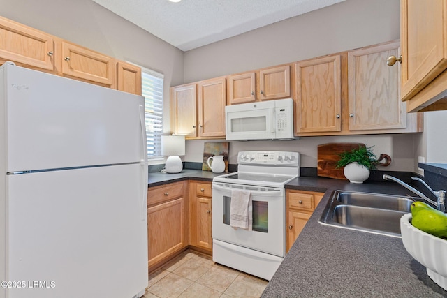 kitchen featuring sink, a textured ceiling, light brown cabinets, light tile patterned floors, and white appliances