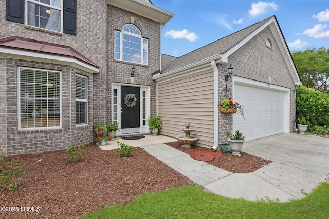 2239 Blakers Blvd, Bluffton, SC 29909 - view of front of home featuring brick siding, a garage, driveway, and roof with shingles