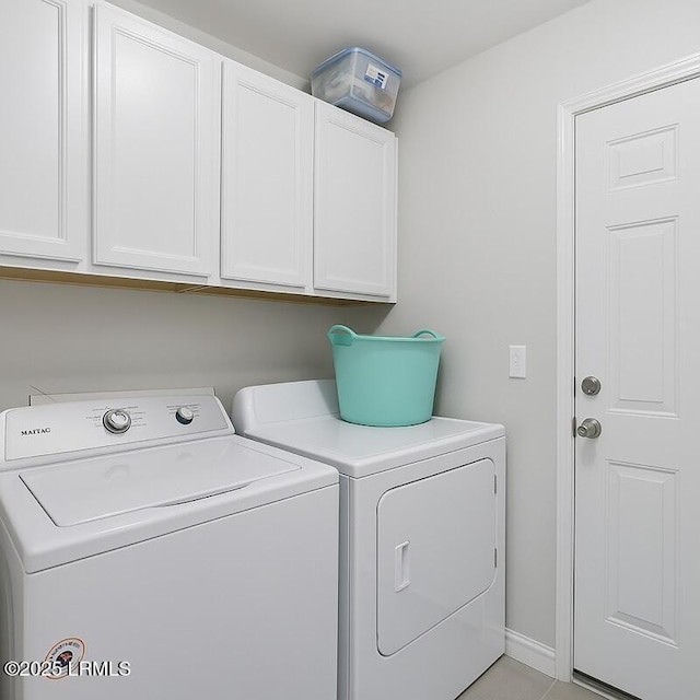 2239 Blakers Blvd, Bluffton, SC 29909 - laundry area with cabinet space, washing machine and dryer, and baseboards