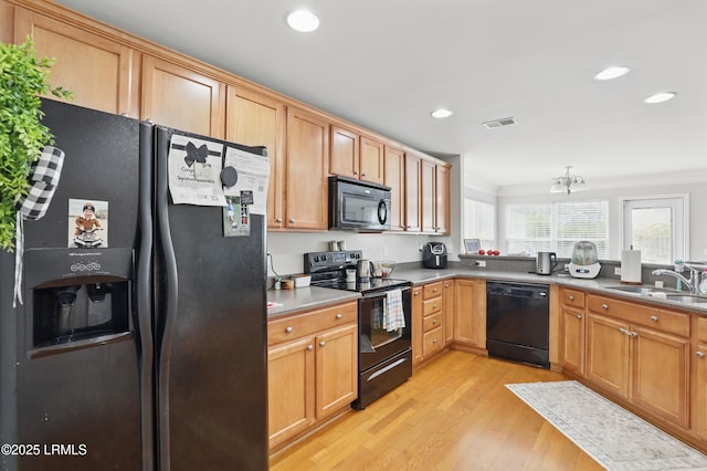 2239 Blakers Blvd, Bluffton, SC 29909 - kitchen with black appliances, a sink, light wood-style floors, and recessed lighting