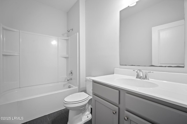 full bathroom with vanity,  shower combination, and toilet