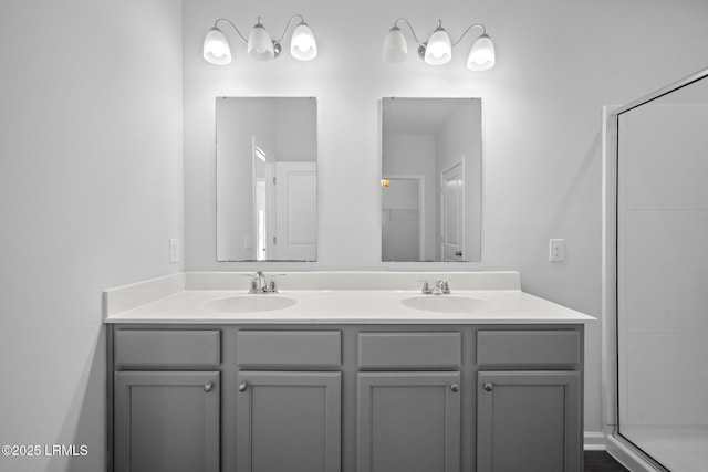 bathroom featuring vanity and an enclosed shower