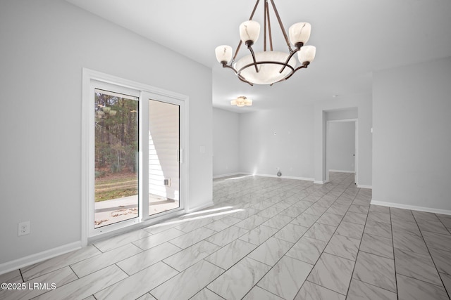 spare room with an inviting chandelier